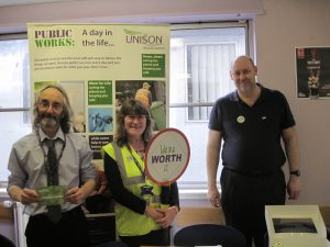 UNISON activists at Woodhill House say, "You're worth it!"